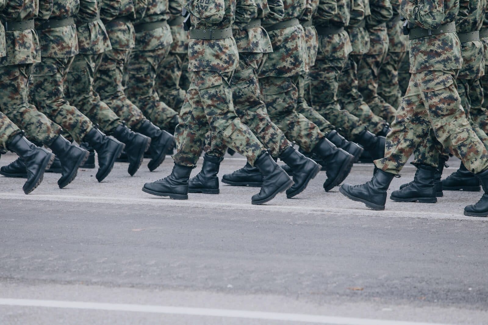 Soldiers marching in formation, boots striking the ground in unison